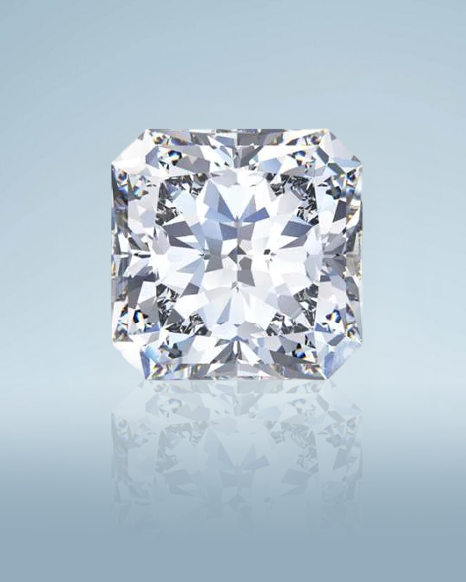 Kay radiant-cut diamond showcased in a close-up gemstone portrait, highlighting the distinctive trimmed-corner shape, exceptional brilliance, crisp faceting, and mirror-like reflection against a soft blue background.