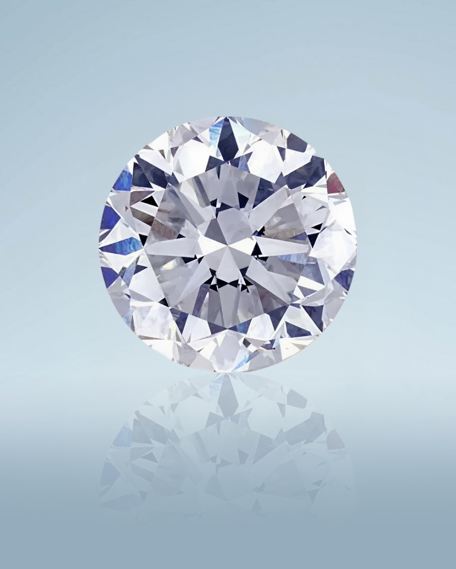 Kay round brilliant-cut diamond showcased in a close-up gemstone portrait, highlighting exceptional sparkle, precision faceting, and light reflection against a soft blue background.