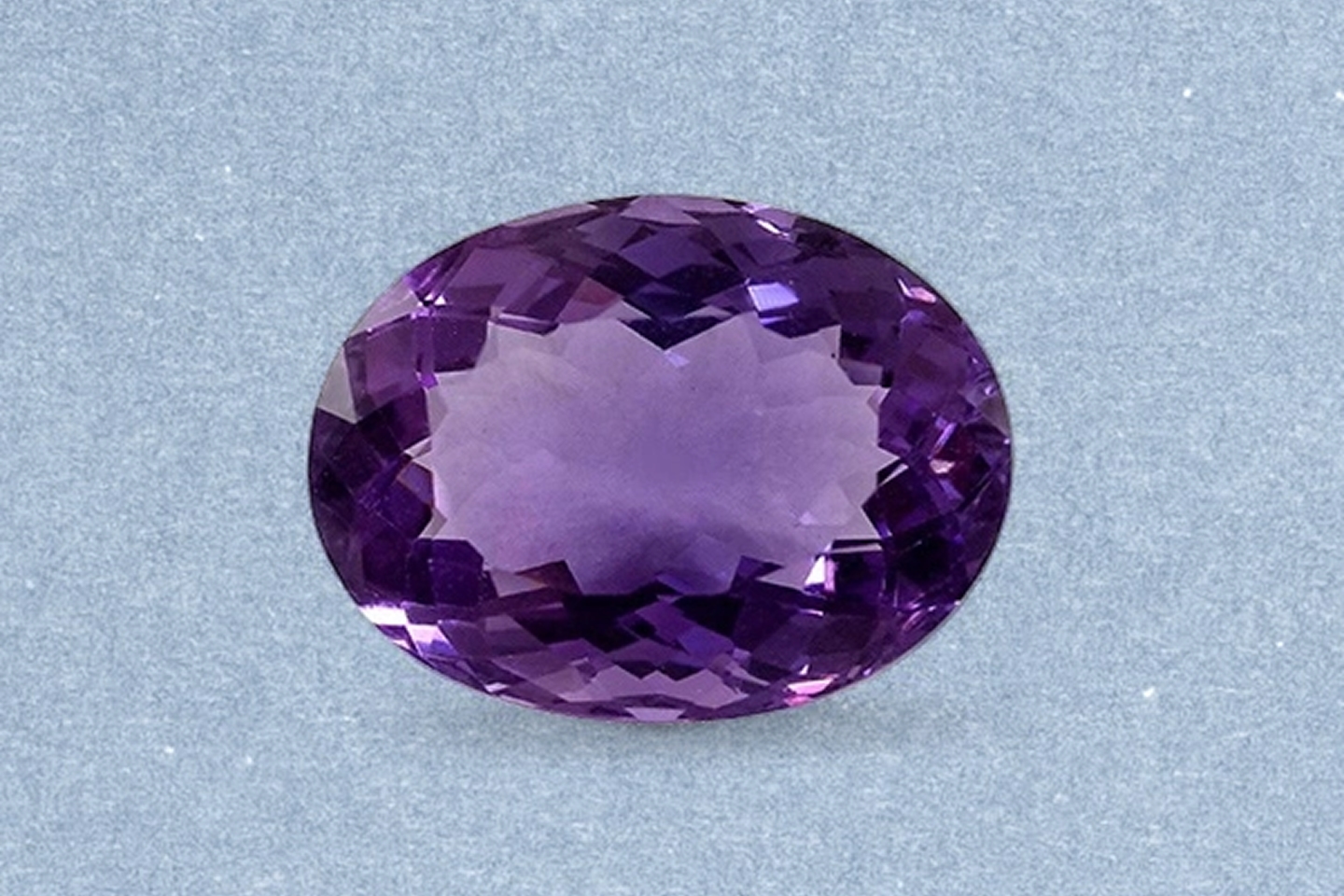 Kay Amethyst – Oval-cut amethyst gemstone featuring rich purple color, exceptional clarity, and brilliant faceted sparkle.