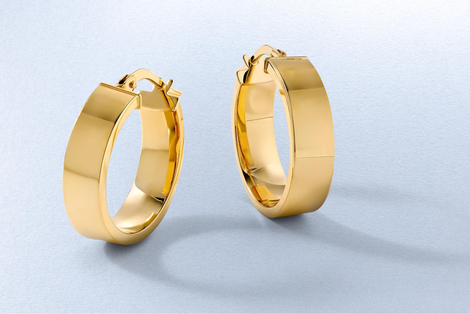 Kay yellow gold hoop earrings featuring a sleek polished finish and modern wide-profile design for effortless everyday style.