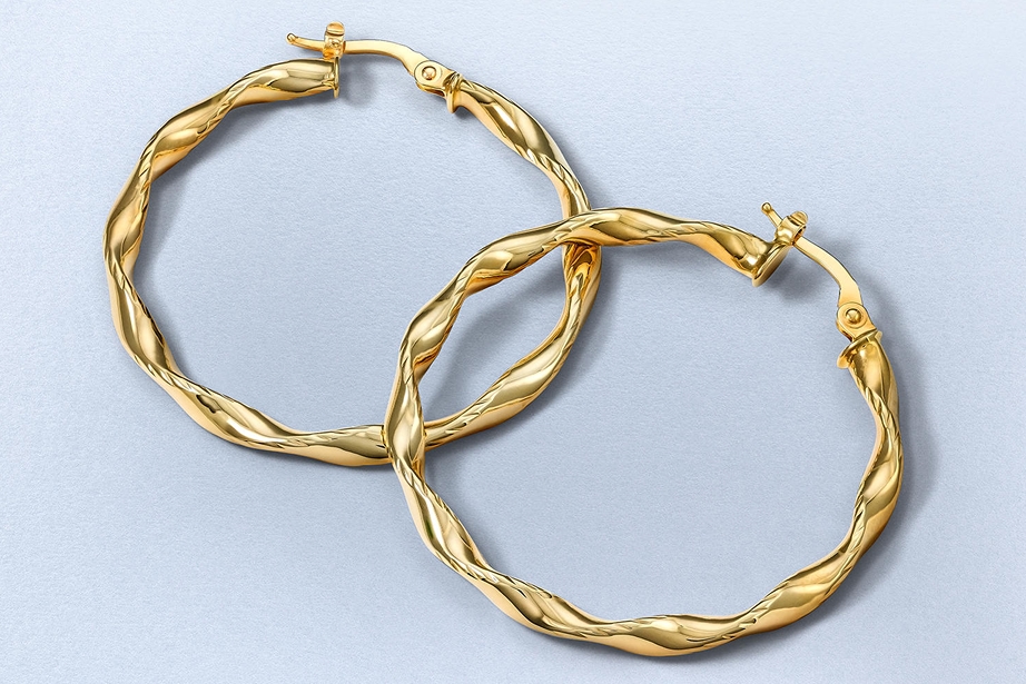 Kay gold vermeil twisted hoop earrings with a polished sculpted design and modern statement style