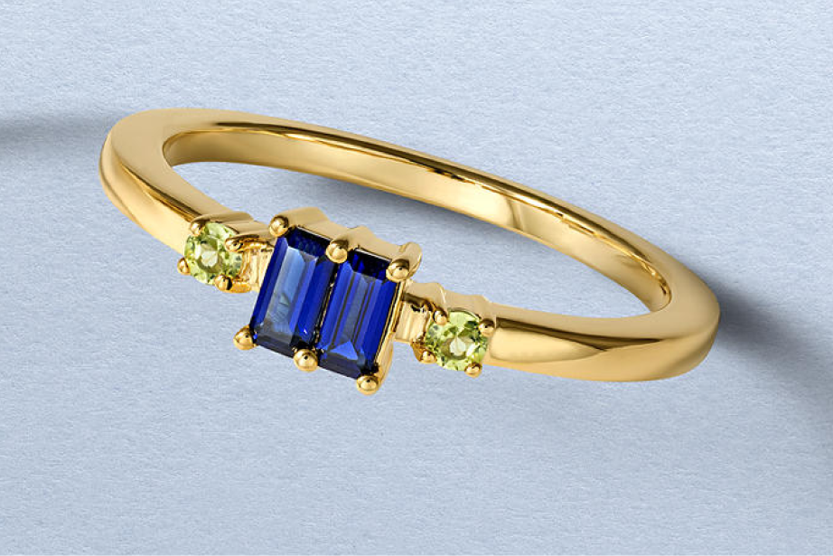 Kay gold vermeil gemstone ring featuring emerald-cut blue sapphires accented by round green gemstones in a sleek modern setting