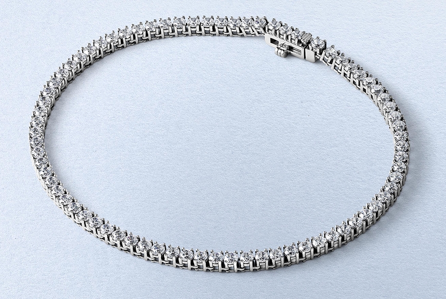 Kay round-cut diamond tennis bracelet in sterling silver with a continuous row of sparkling diamonds and secure box clasp
