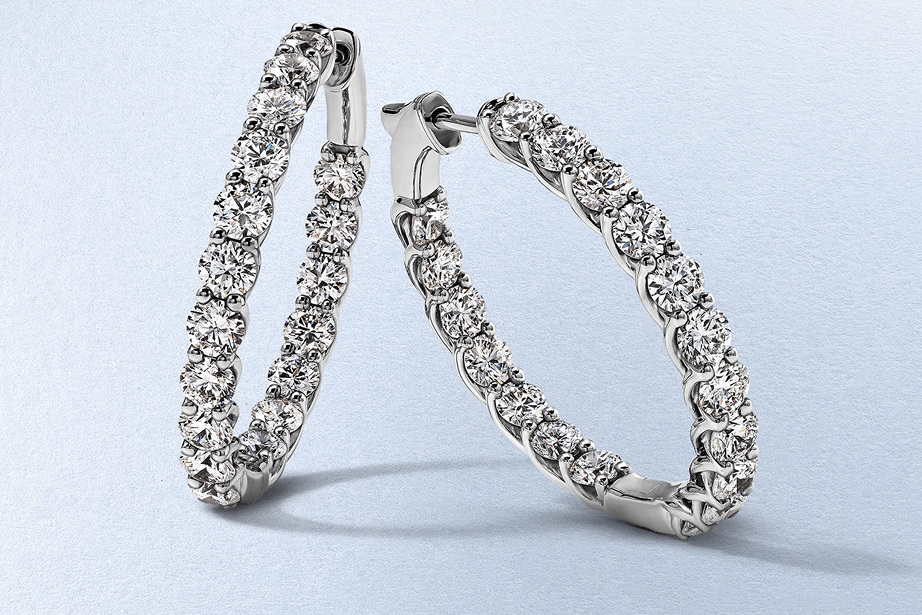 Kay round-cut diamond hoop earrings in sterling silver featuring inside-out diamond accents for maximum sparkle