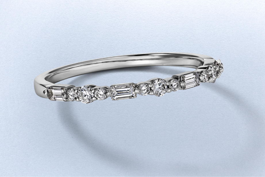 Kay diamond band ring in sterling silver featuring alternating round and baguette-cut diamonds in a delicate stackable design
