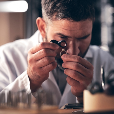 Image of jeweler inspecting ring