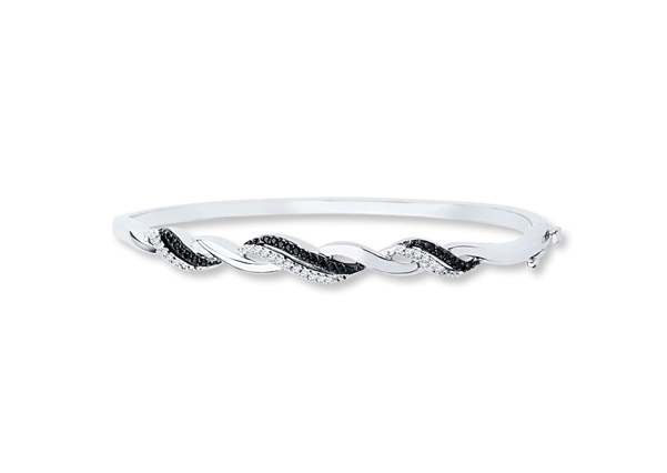 A stunning bracelet from KAY, featuring entwined colorless and black diamonds