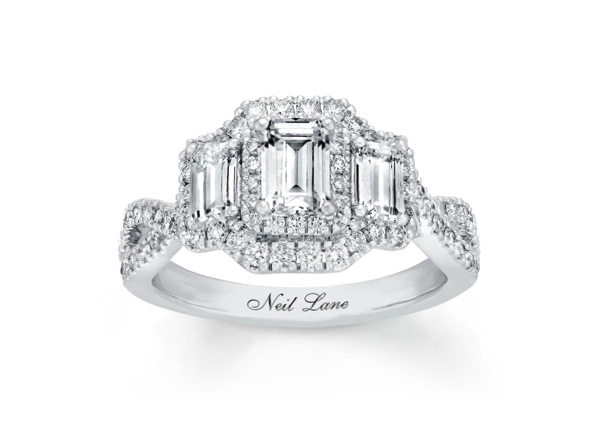 An emerald-cut diamond engagement ring in a vintage inspired setting