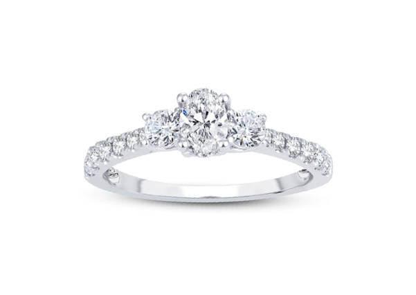 An oval-cut engagement ring in a three stone setting