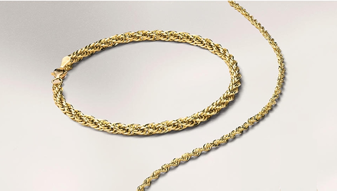 A matching women's gold, chain bracelet and chain necklace from KAY.
