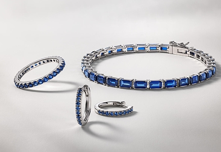 A matching set of sapphire studded earrings, rings, and a bracelet from KAY.