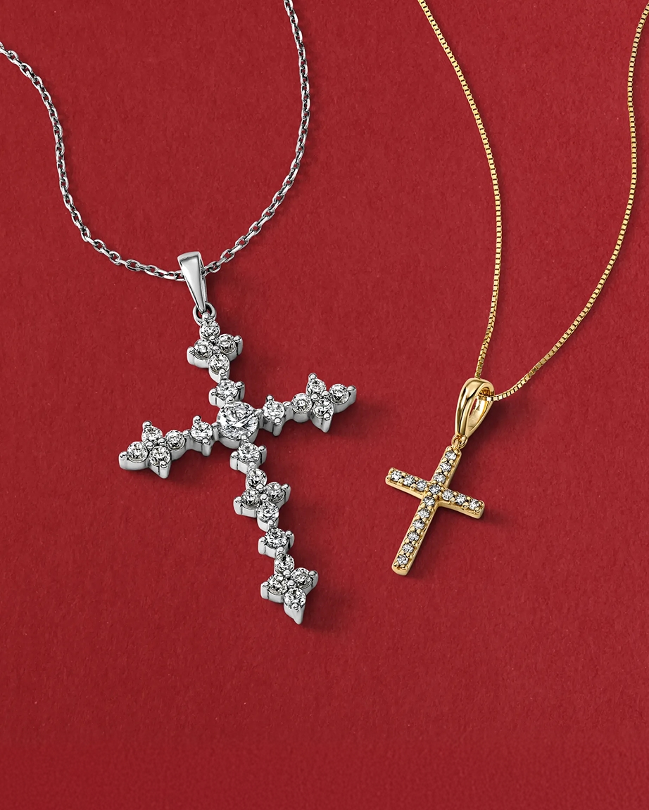 Two cross necklaces, onesilver and the other gold, from KAY.