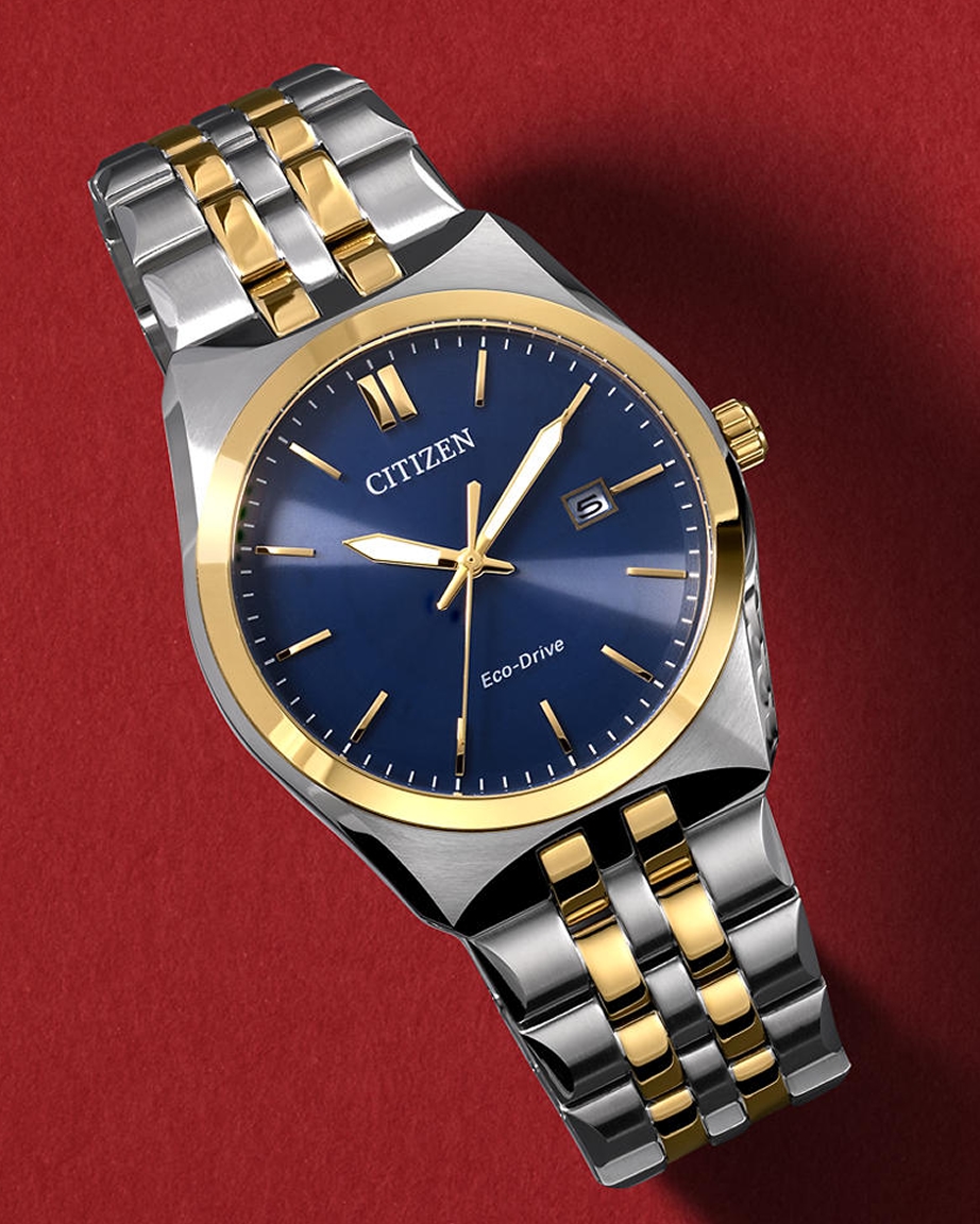 A gold and silver Citizen Eco-Drive watch with a sapphire blue face, from KAY.