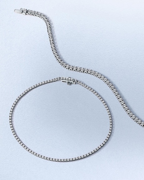 A matching pair of diamond tennis bracelet and necklace, from KAY.