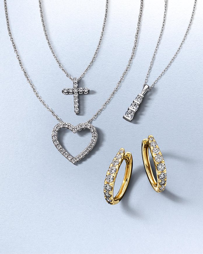 Various gold and silver, diamond studded jewelry pieces from KAY.