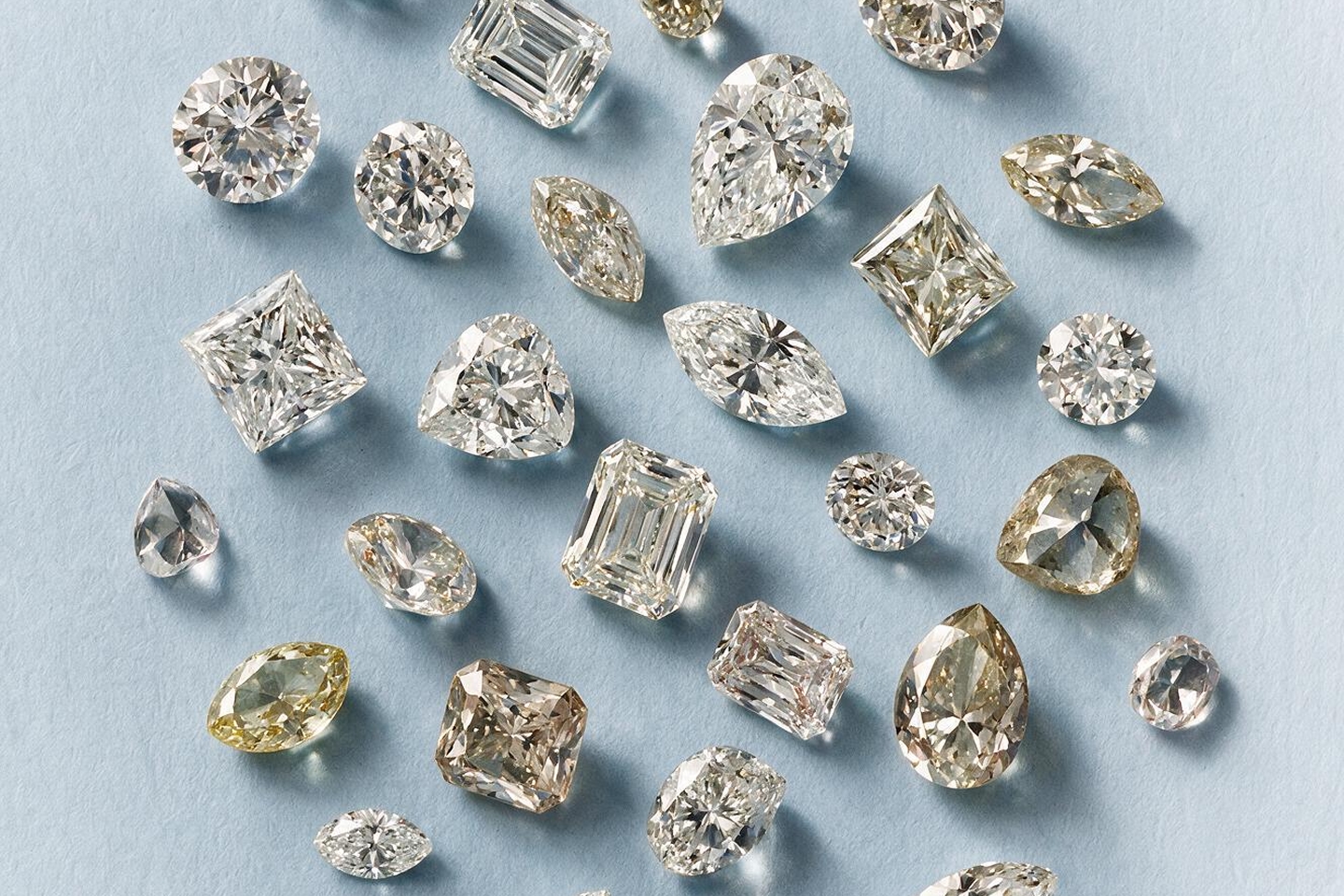 An assortment of diamonds in various cuts and color from KAY.