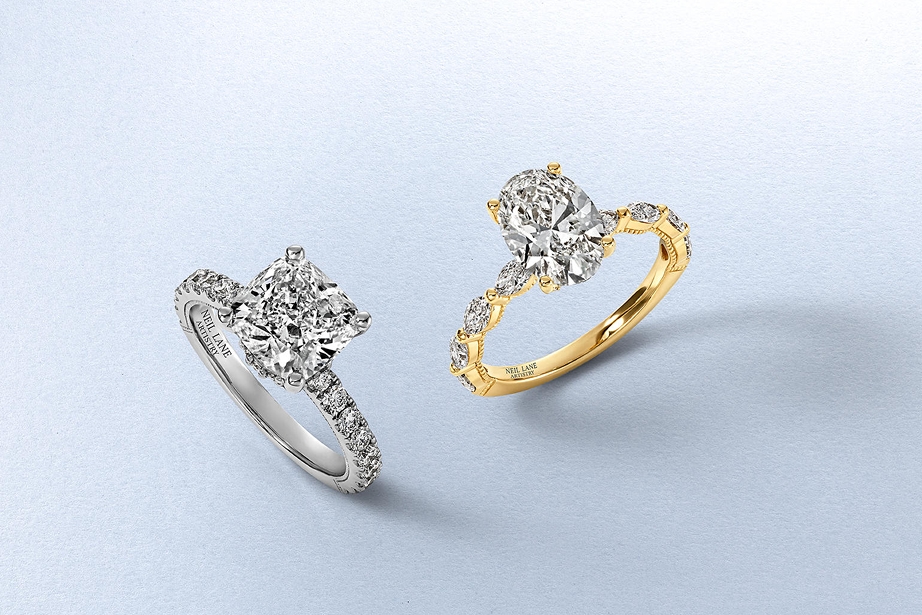 Two diamond rings, one gold and one silver, by KAY.