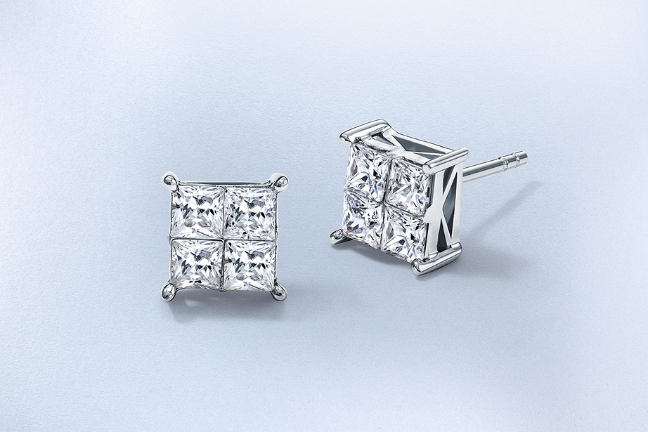 A pair of diamond stud earrings by KAY.