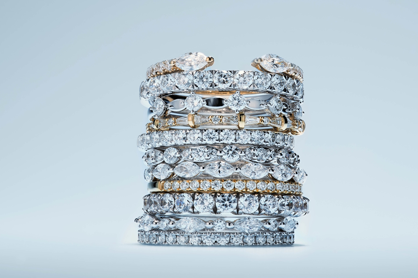 A mound of stacking rings in various stones and metals from KAY.