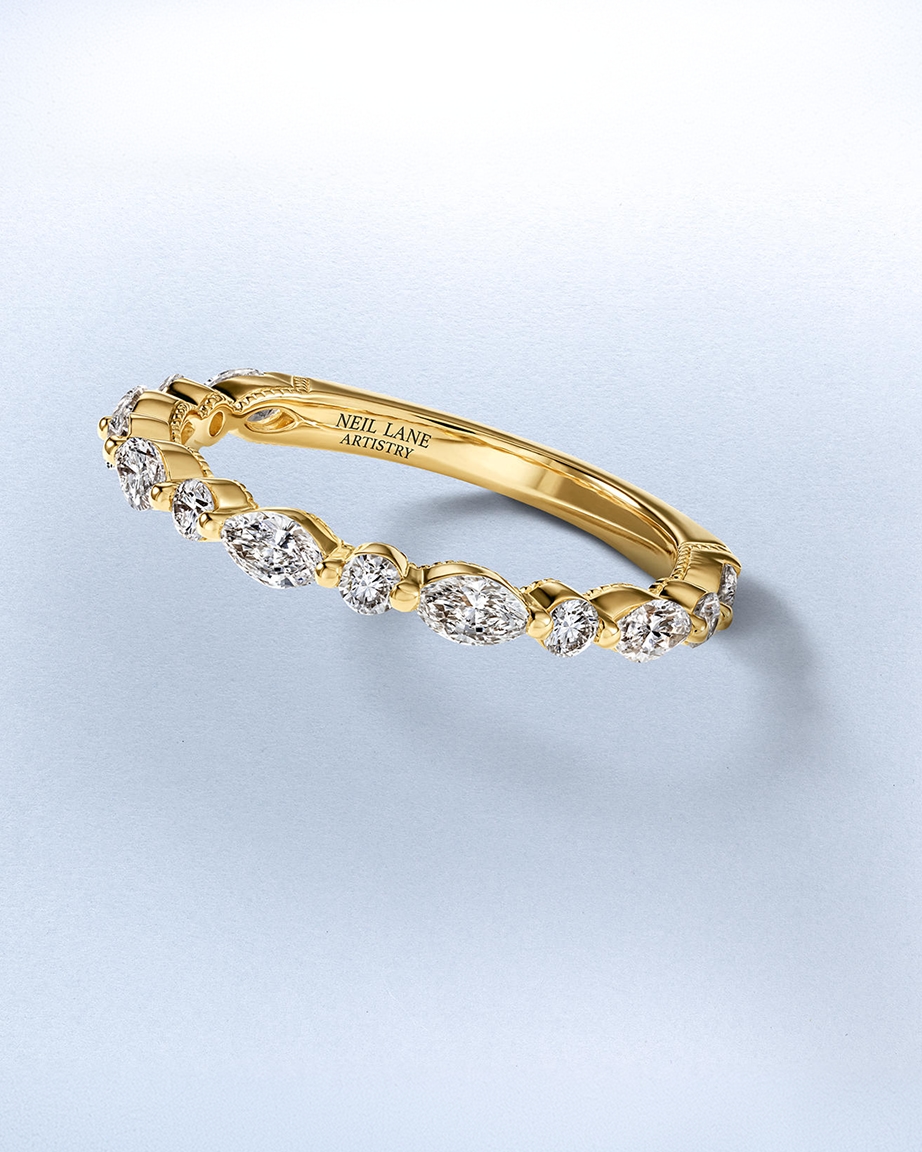A diamond inlaid, gold anniversary ring from KAY.