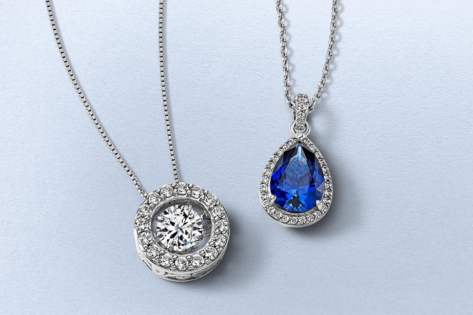 Two diamond pendant necklaces from KAY.