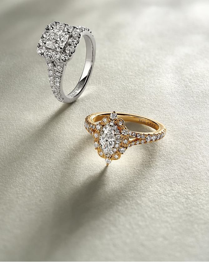 Two diamond engagement rings showcasing diamond color; one gold, one silver, by KAY.