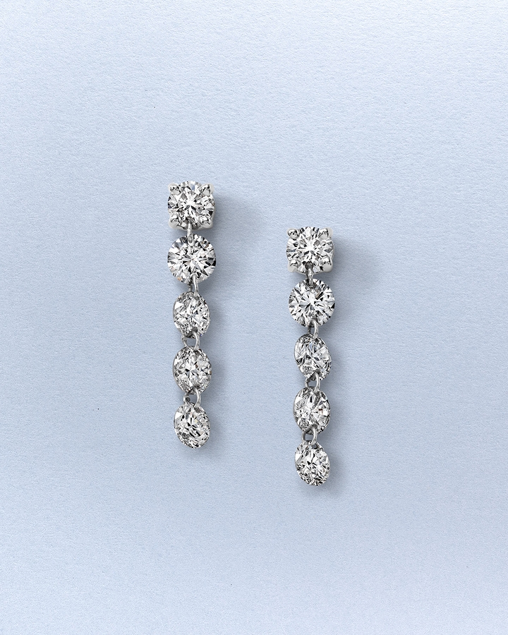 A pair of diamond drop earrings from KAY.
