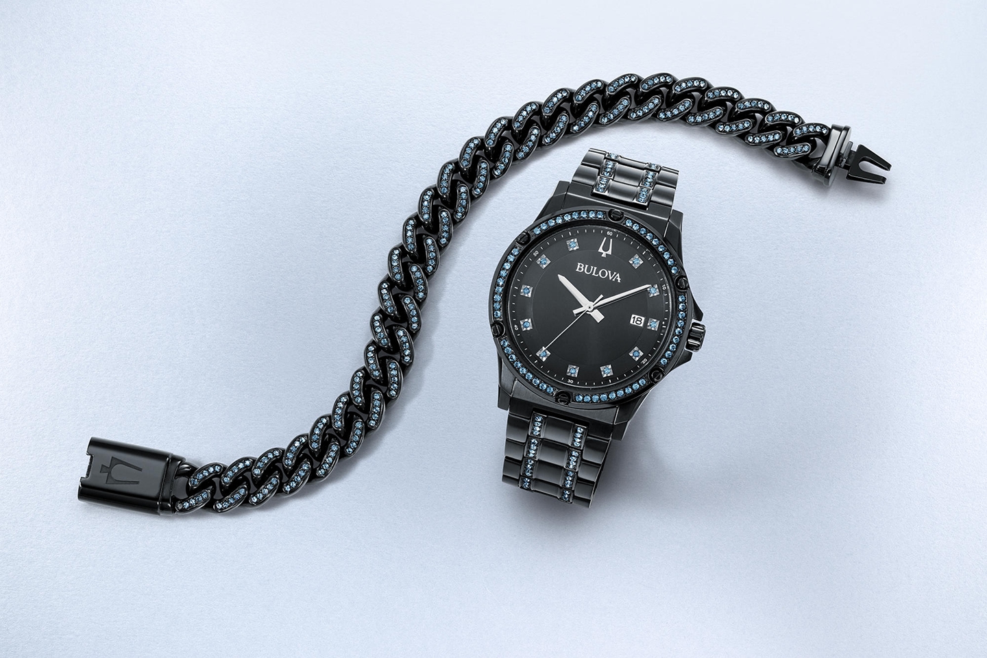 A stainless steel chain bracelet with a matching stainless steel watch from KAY.