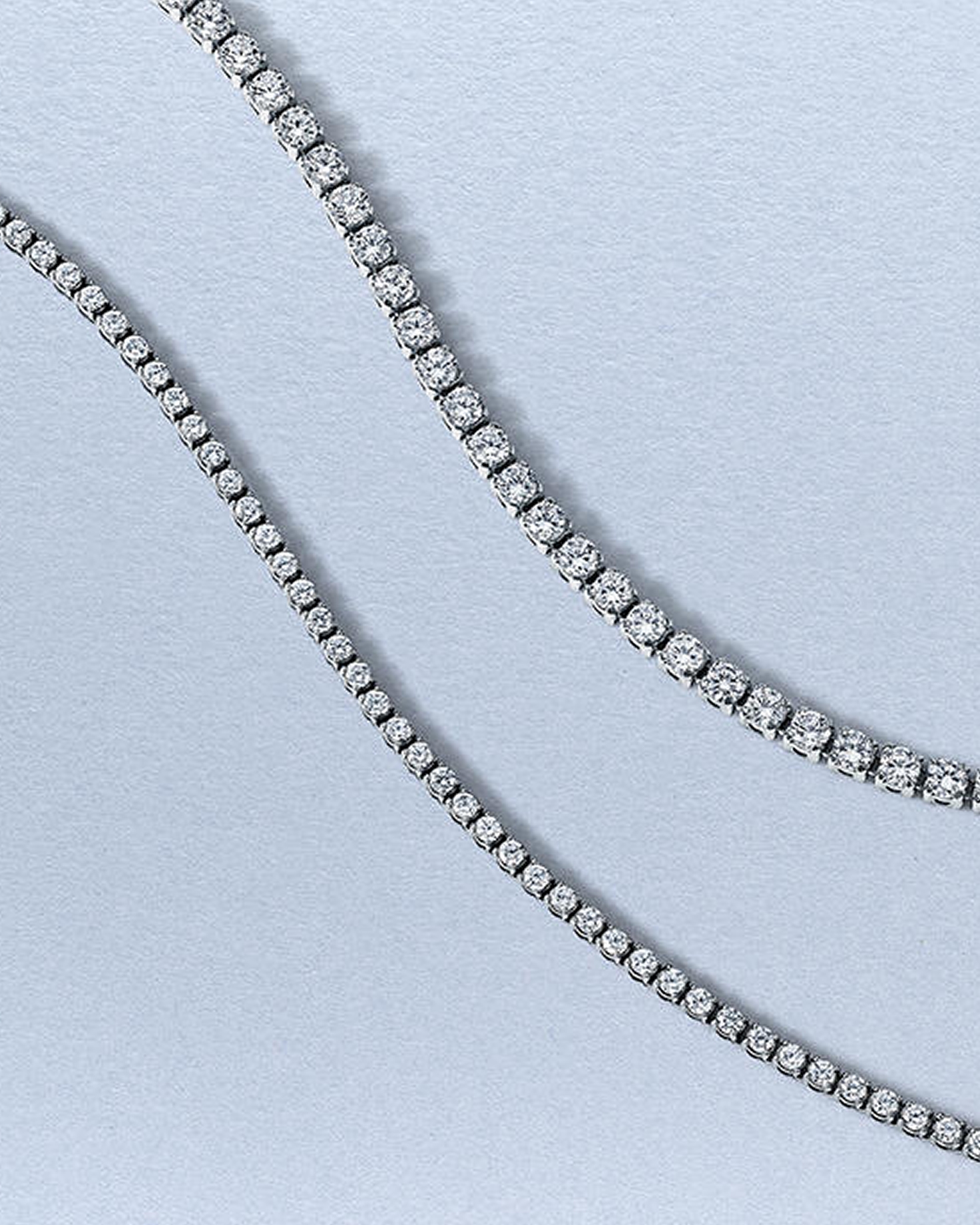 A diamond tennis necklace and matching bracelet from KAY.