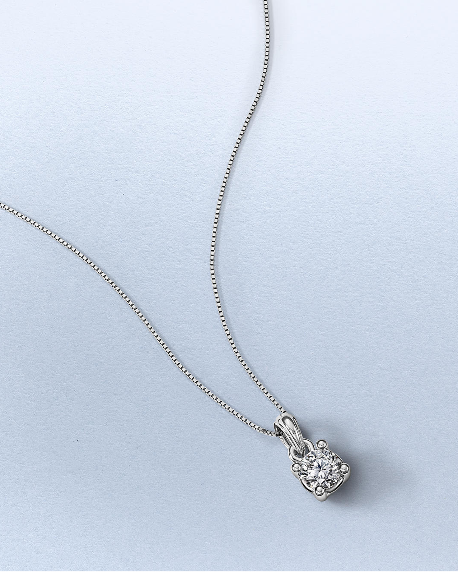 A diamond, solitaire pendant on a silver chain from KAY.