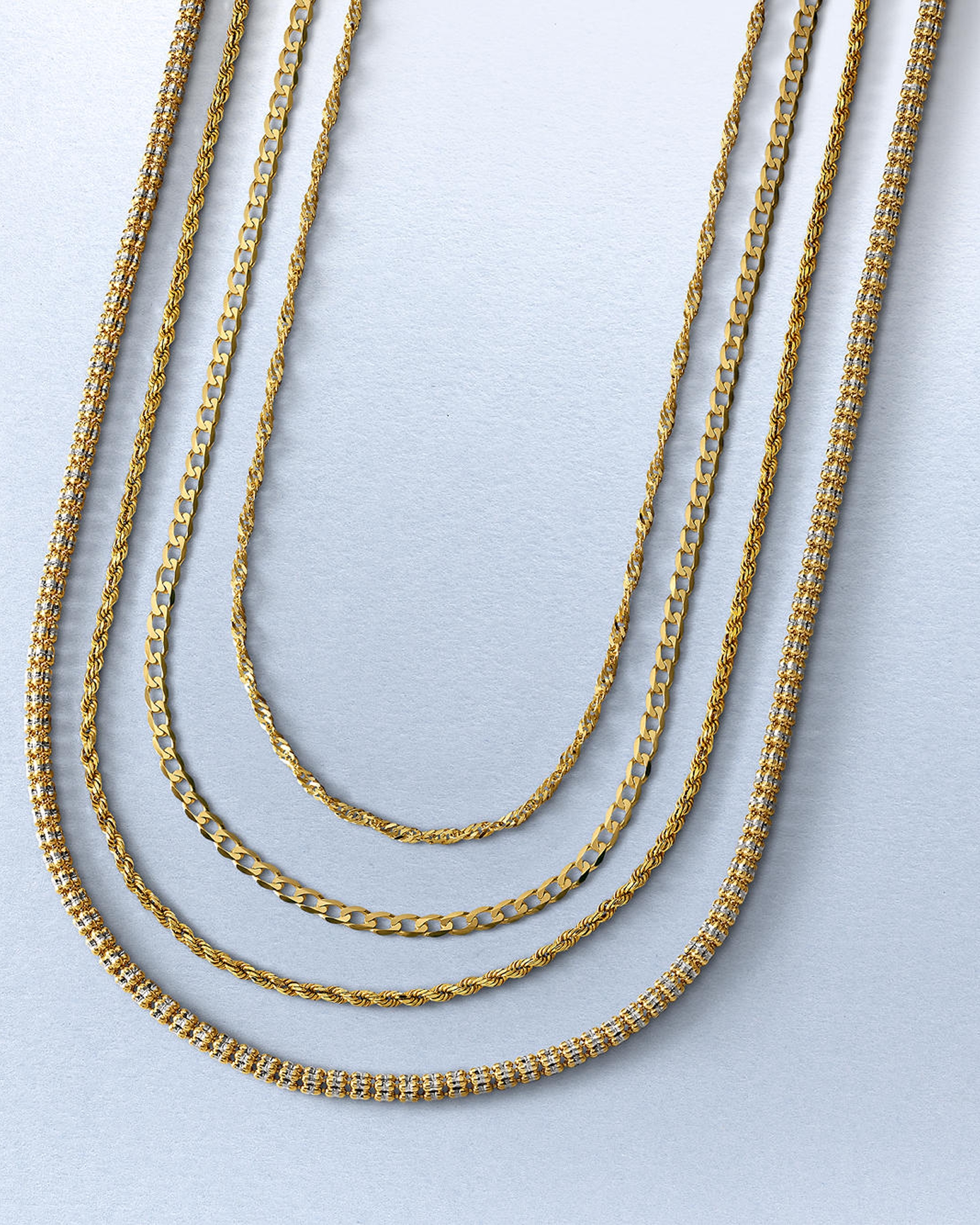 Four different types of gold chains from KAY.