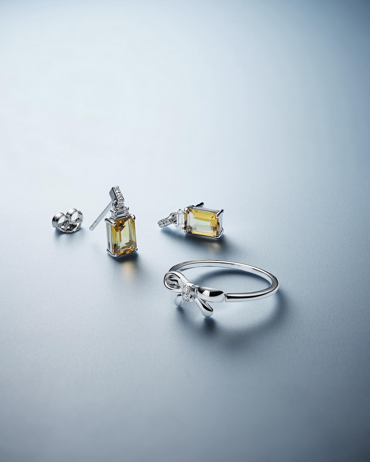 A set of topaz earrings with a diamond ring from KAY.