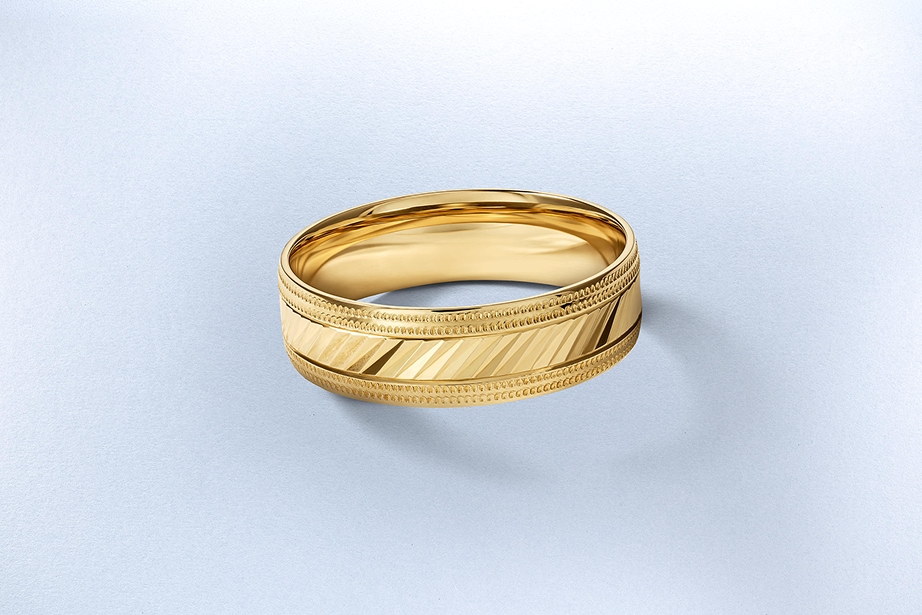 A gold wedding band from KAY.