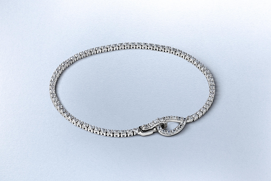 A white gold diamond tennis bracelet from KAY.