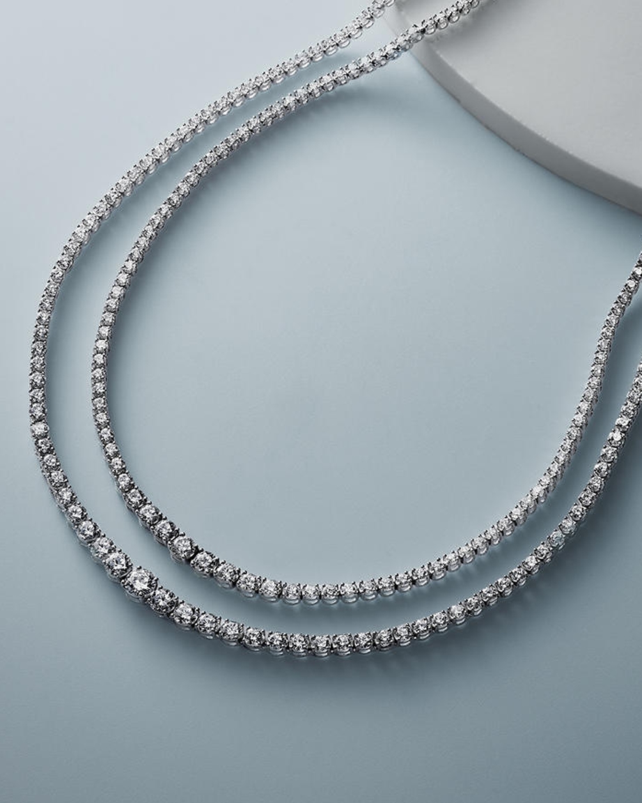 Two diamond and silver tennis necklaces from KAY.