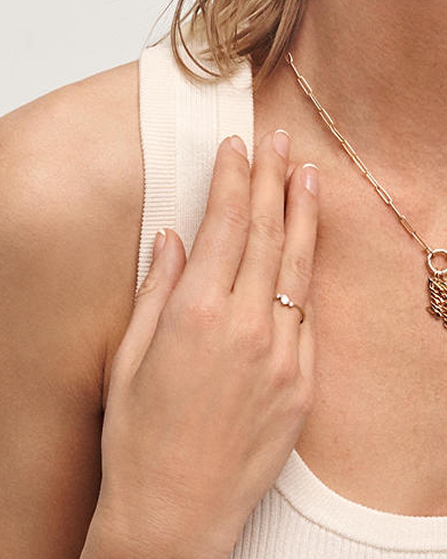 A woman sporting a very simple. yet elegant diamond promise ring from KAY.