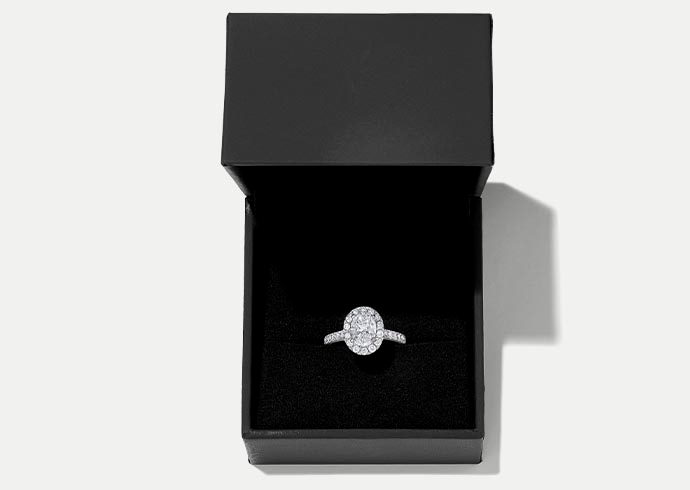 A KAY diamond engagement ring in its box