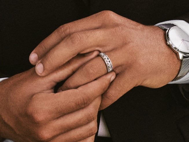 Premium Photo | A man holds wedding rings in his hand