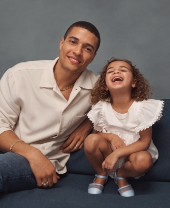 Image of father and daughter smiling