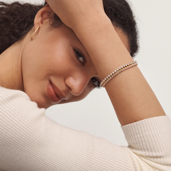 Woman showing off diamond bracelet