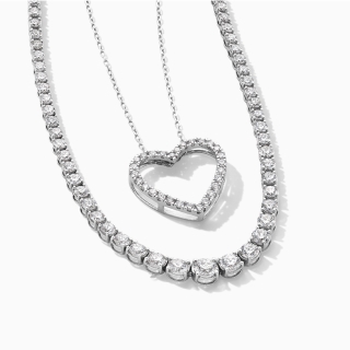 A diamond chain with a diamond heart pendant.