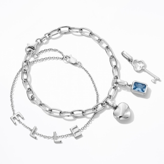 Personalized silver charm bracelets by Kay.