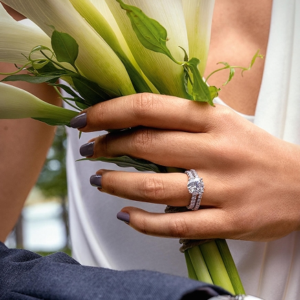 A woman wearing a silver banded diamond ring from The LEO Legacy Collection