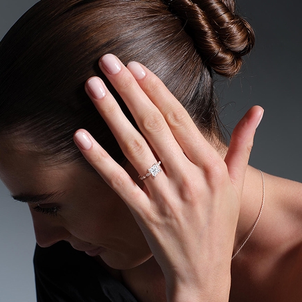 A model showing off a diamond ring and bracelet from the Monique Lhuillier Bliss collection.