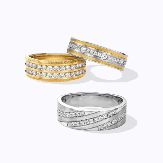 Three diamond encrusted bands. One gold and two silver.