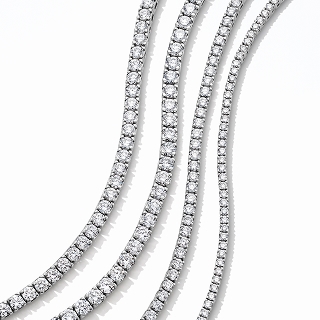 Four differing sized diamond necklaces side by side.