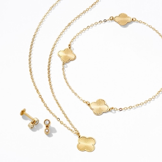 A set of diamond studded, gold earrings, and two gold necklaces.