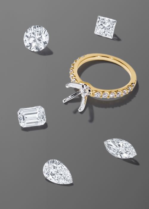 Ring and setting surrounded by various loose diamonds