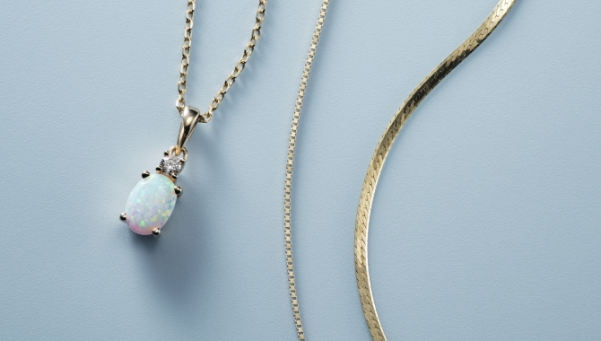 Image of opal necklace and two gold chain necklaces