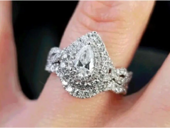A diamond ring displayed beautifully on a hand